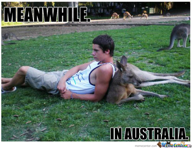 A man lays down back-to-back with a kangaroo