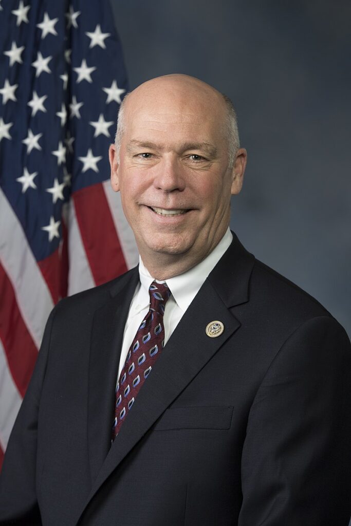 Photo of Rep. Greg Gianforte (R-MT), a balding, smiling white man in a black suit