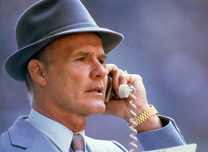 Photo of former Dallas Cowboys head coach Tom Landry in his trademark gray felt hat